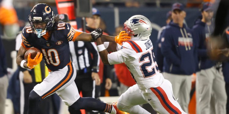 Chicago Bears wide receiver Luther Burden III (10) runs with the ball during an NFL against the New England Patriots in Chicago, Thursday, Oct. 22, 2026. (AP Photo/Jeffrey Phelps)