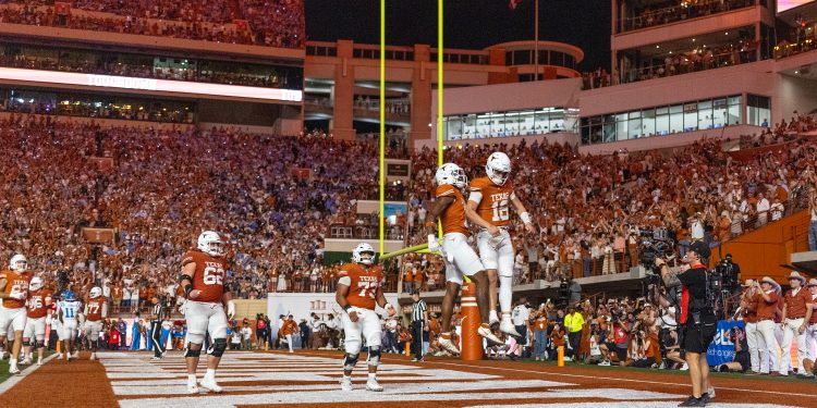 Texas quarterback Arch Manning, left, celebrates with a jump in the end zone with Texas running back Michael Terry III (11) during the second half of an NCAA college football game in Austin, Texas, Saturday, Oct. 24, 2026. (AP Photo/Stephen Spillman)